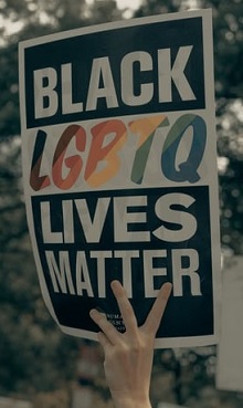 Black lgbtq lives matter sign